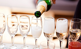 Champagne being poured into flutes