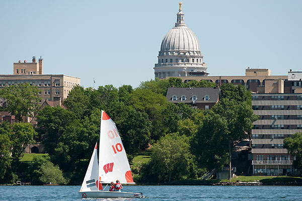 UW sailboat on Lake Mendota with the capitol building in the distance