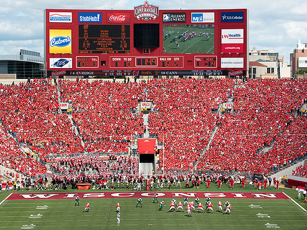 UW Badgers playing at Camp Randall Stadium, packed with fans adorned in red