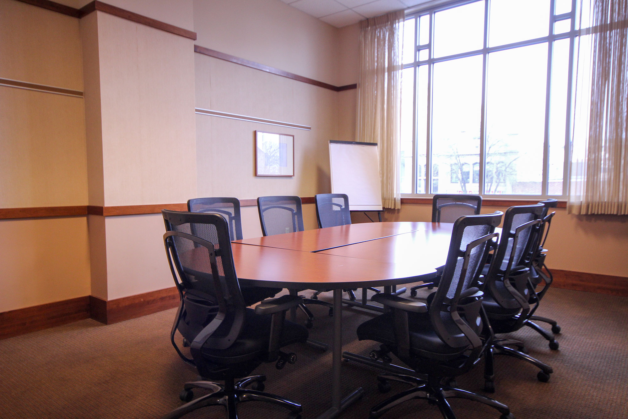 Boardroom with oval table and sunny window