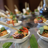 Catered appetizers in ceramic serving spoons