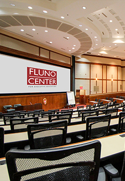Fluno center auditorium with rows of seats and tables, ready for a presentation