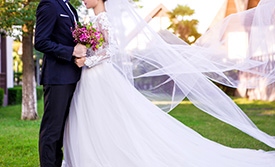 Close up shot of bride and groom embracing