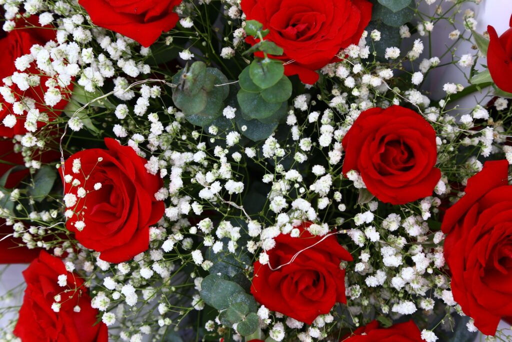 Arrangement of roses, eucalyptus, and baby's breath