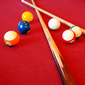 Closeup of pool cues and billiards at Smitty's