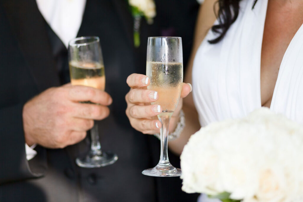 Bridge and groom toast champagne